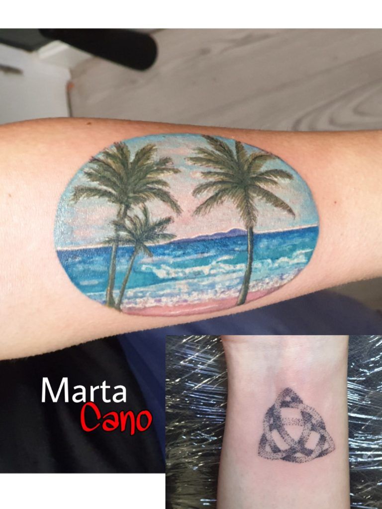 Tatuaje isla watercolor en el brazo