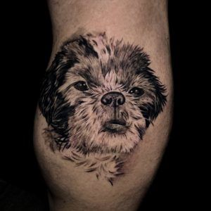 Tatuaje de un perrito estilo realismo