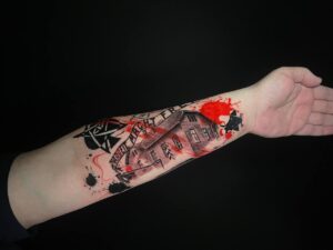 tatuaje estilo trash polka en el antebrazo
