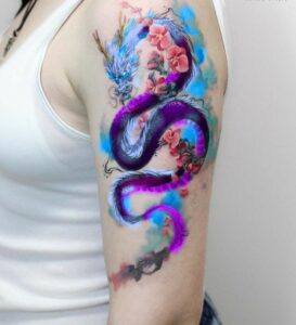 tatuaje anime de animales- dragón en el brazo watercolor